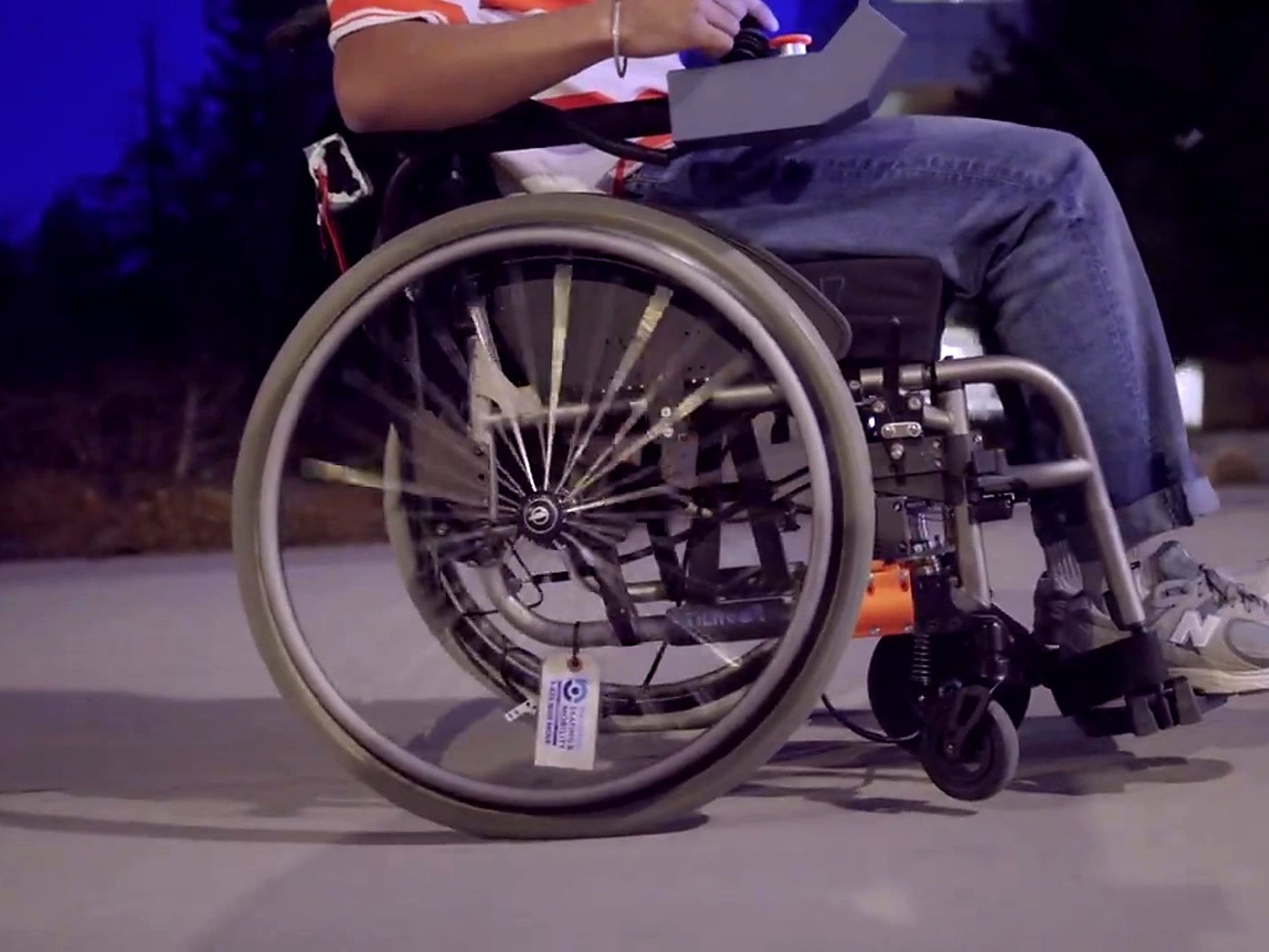 Friction Robotics uncased prototype mounted under a manual wheelchair